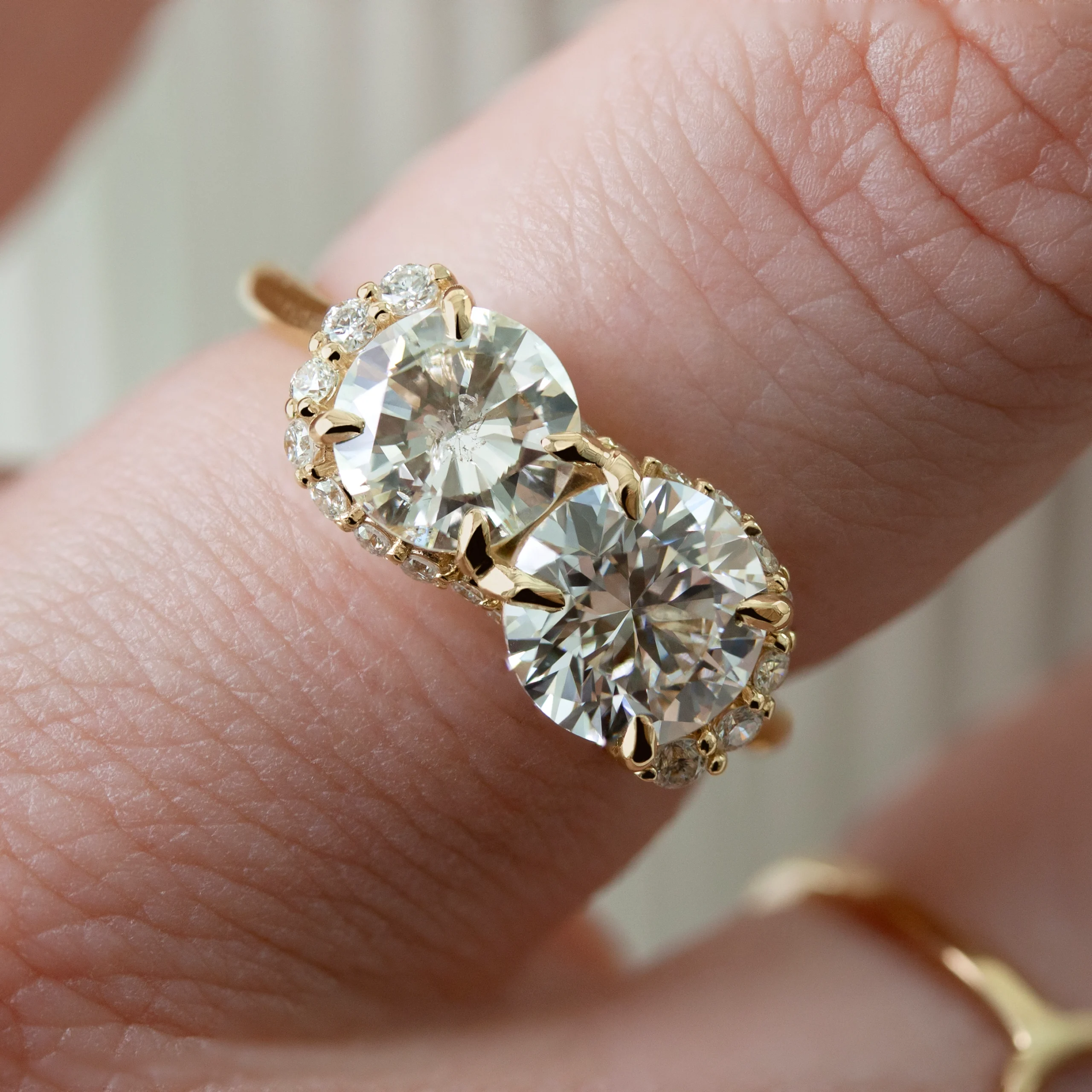 Spiral Staircase Ring by Philadelphia's Emily Chelsea Jewelry, featuring a swirling crescendo of reclaimed diamonds, a sparkling center stone, and a 2mm band.