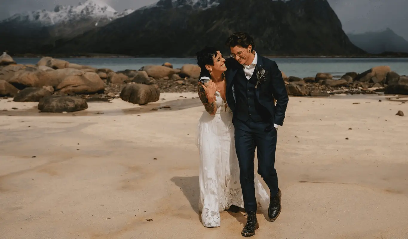 A couple embrace happily at a beach